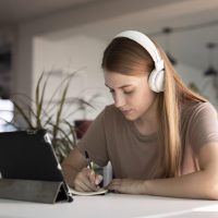 medium-shot-woman-writing-down-information